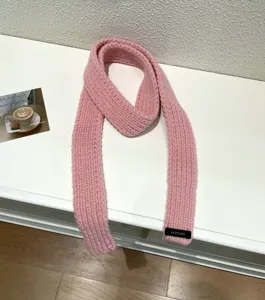 Pink knit scarf for women, cozy winter neckerchief, stylish baguette scarf accessory.