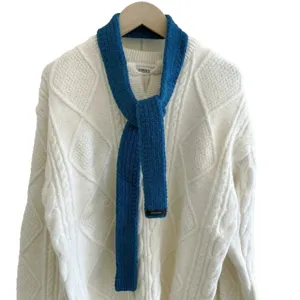 Solid blue knitted narrow scarf, stylish winter baguette wrap and cozy fashion neck warmer.