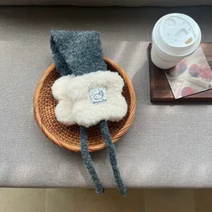 Cozy grey knitted plush earmuffs detail view, winter warm windproof ear warmer for women.