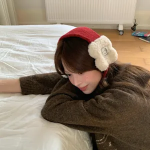 Winter plush earmuffs for women, cozy warm fleece ear warmers, stylish outdoor windproof headwear.