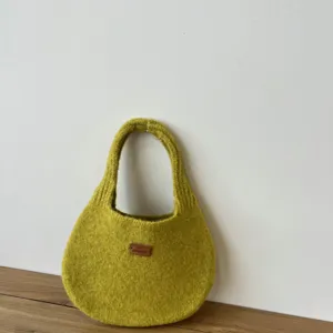 Solid color knit handbag for women, casual autumn winter underarm shoulder bag style.