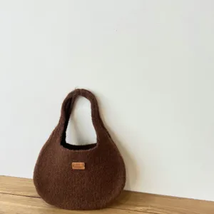 Dark brown knitted underarm bag for women, minimalist solid color shoulder handbag.