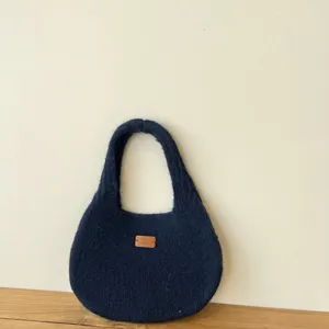 Solid color knitted shoulder bag, minimalist underarm handbag for women, casual daily style.