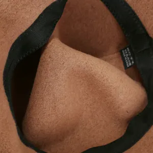 Wool felt bucket hat interior detail showing soft texture and lining craftsmanship.