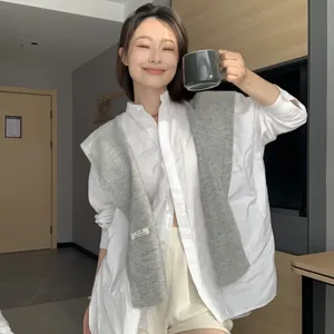 Women wool blend knitted shawl, versatile layering cape accessory for stylish wear.