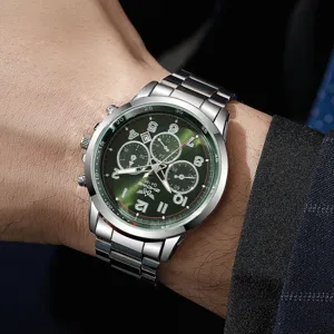 Stainless steel strap detail, green dial with sub-dials and clear markers on male wrist.