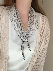 Detailed view of the Korean floral triangular scarf with chic beads, perfect for summer.