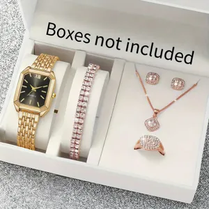 Detail view of women gold quartz watch and crystal jewelry set with bracelet necklace ring.