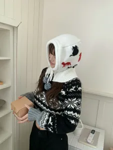Cozy white knit balaclava hat featuring cute cat patterns, winter warm pullover beanie for women.