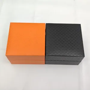 Portable watch and jewelry gift boxes, orange and black textured storage boxes for accessories.