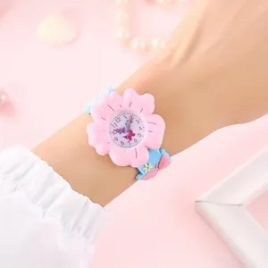 Cute pink flower children quartz watch with soft silicone strap, lovely wrist detail.