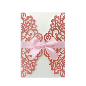 Elegant pink laser cut lace wedding invitation card with glitter and satin bow ribbon