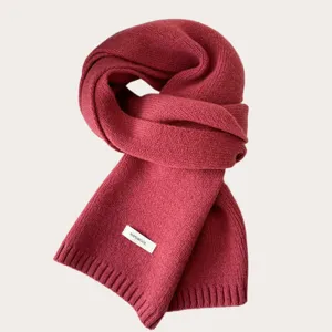 Close-up of knitted wool scarf texture, showing soft winter warm fabric details clearly.
