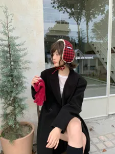 Cozy winter red and black plaid fluffy earmuffs with soft plush trim for cold weather.