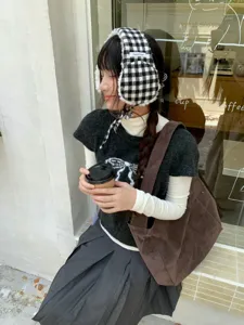 Thickened plush plaid earmuffs for women, cozy winter warm ear warmers, stylish outdoor wear.