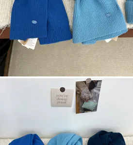 Detailed view of cozy blue knitted hat and scarf set, soft wool texture for winter warmth.