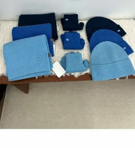 Knitted winter set including scarf beanie and gloves in blue ribbed design warm and stylish.