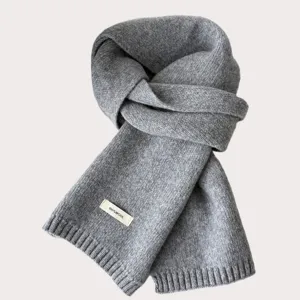 Grey knit wool scarf detail view, showing soft texture, cozy winter accessory design.