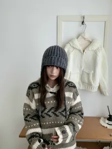 Korean style thick knit balaclava earflap winter warm beanie hat and cozy sweater outfit detail.
