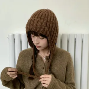 Chunky knit balaclava hat for women, warm winter earflap beanie in stylish brown color.