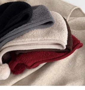 Korean style 100% wool pom-pom balaclava knit ear-flap hat detail shot showcasing rich winter colors.