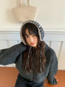 Plush plaid earflap hat for women, thick warm winter trapper cap with braided ties.