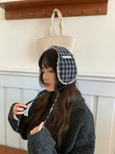 Thickened warm plush plaid earmuffs for women, cute winter ear warmers with soft fleece lining.