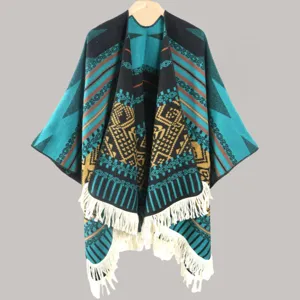 Ethnic geometric knitted poncho with fringe hem, cozy winter cape and shawl for travel outdoor.
