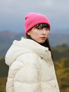 Chic pink wool knit beanie detail shot, soft texture for outdoor travel cold weather warmth.