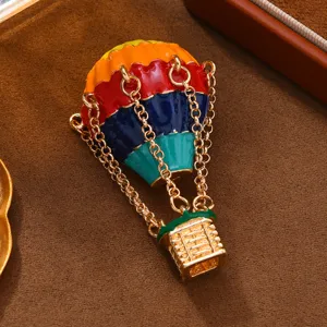 Enamel hot air balloon brooch for women, elegant vintage sweater pin jewelry accessory.