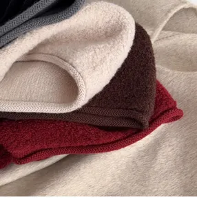 Knit wool balaclava cap detail showcasing soft texture and multiple classic color options.