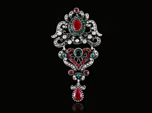Vintage baroque style metal alloy brooch with red green rhinestones for women dress detail