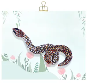 Vintage snake rhinestone brooch for men and women, elegant crystal animal pin accessory.