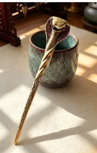 Retro cobra hair stick with red rhinestones, vintage alloy hairpin for women bridal hair styling.