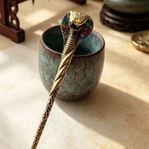 Retro cobra hairpin with colorful rhinestones, alloy hair accessory for elegant bridal buns.