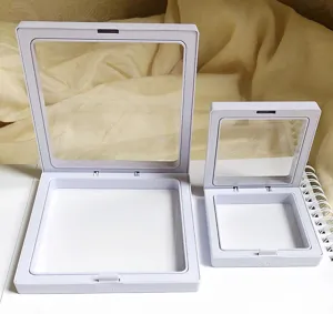 White PE film floating jewelry display boxes detail view, transparent packaging for small items.
