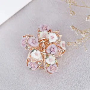 Vintage soft clay rose small hair claw clip with alloy floral design and rhinestones for women.