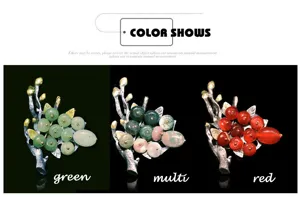 Detailed view of fruit branch brooch with bead clusters in green, red, and multi finishes.