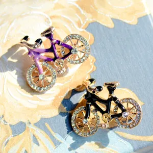 Cute bicycle brooch detail shot, alloy rhinestone crystal design, stylish lapel pin accessory.