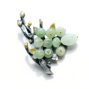 Vintage retro style branch green stone brooch detail, elegant decorative pin for women coats.