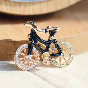 Vintage creative bicycle brooch pin with black enamel and sparkling rhinestones for apparel.