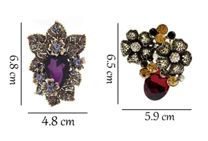 Close-up detail view of vintage crystal rhinestone floral brooches featuring clear dimension metrics.