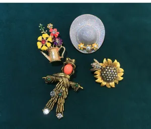 Retro pastoral style rhinestone brooch detail showing exquisite vintage flower and hat designs.