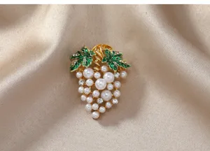 Elegant pearl grape brooch with green leaves and rhinestones, perfect sweater accessory.