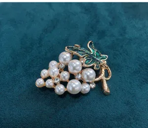 Pearl grape brooch with green enamel leaves, elegant rhinestone jewelry pin for sweaters and coats.