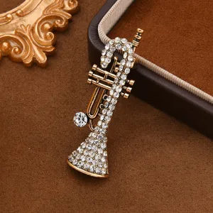 Vintage rhinestone trumpet brooch pin, elegant musical instrument lapel pin for coat dress.