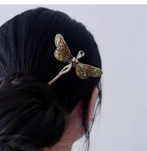 Retro enamel dragonfly hairpin detail view, elegant metal hair stick for buns and vintage styling.