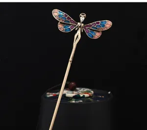 Detail view of vintage enamel fairy dragonfly hairpin, elegant brass rod for elegant buns.