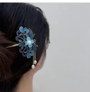 Blue enameled floral hair stick with freshwater pearl tassel, elegant Hanfu accessory detail.