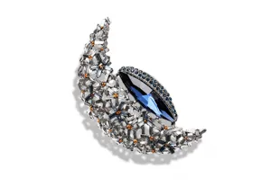 Vintage silver crescent moon brooch with large dark blue crystal and rhinestones for sweater.